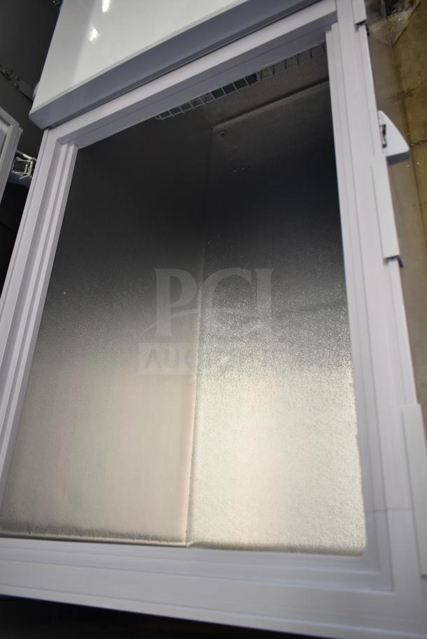 Brand new KoolMore SCF-24C 77 in. commercial chest freezer, 24 cu ft., 115 volts, with minor scratches and dents visible.