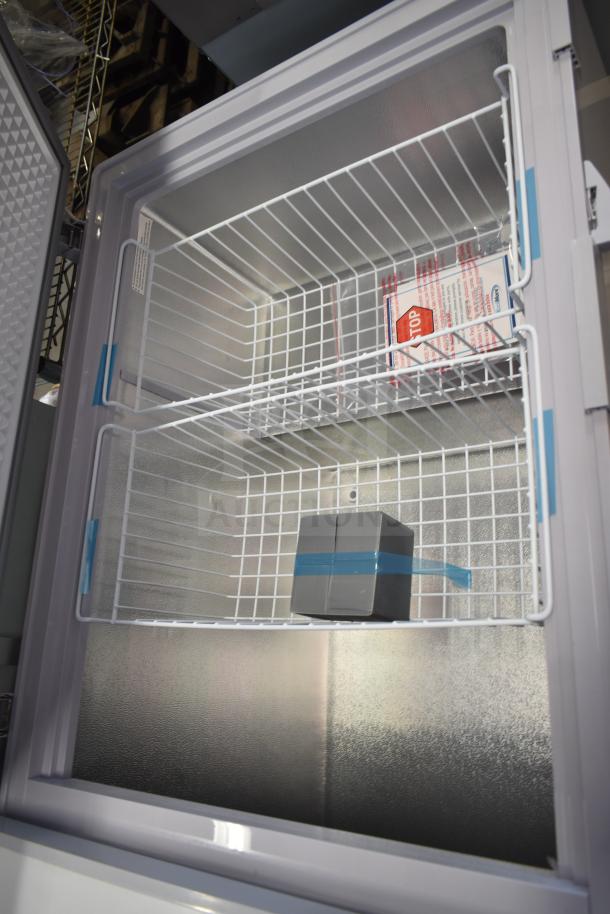 BRAND NEW KoolMore SCF-24C 77" Commercial Chest Freezer, 24 cu ft, scratch and dent, 115V, open lid view with shelves.