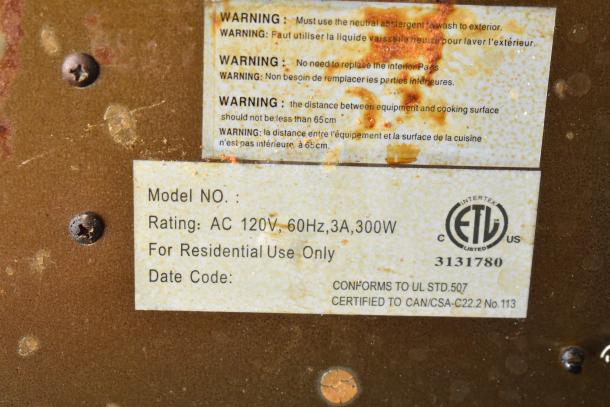 Range hood label showing AC 120V, 60Hz, 3A, 300W rating, residential use, ETL certification, and warning instructions.