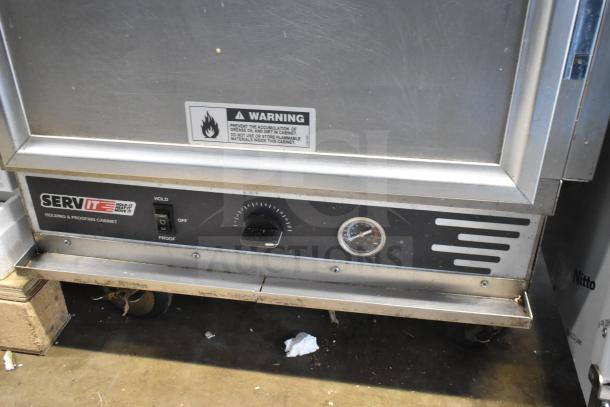 2023 ServIt 423CC1UFISD Commercial Insulated Cabinet with solid Dutch doors, 120V, visible controls and warning label.