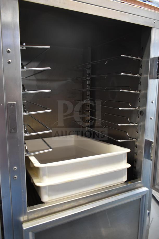 2023 ServIt 423CC1UFISD commercial holding cabinet with solid Dutch doors, stainless steel interior, and adjustable racks.