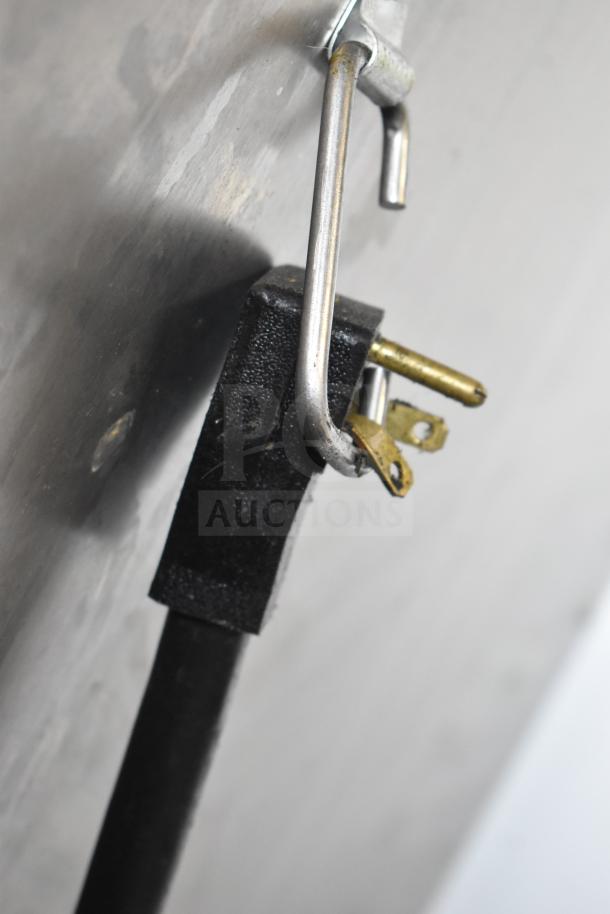 2023 ServIt 423CC1UFISD Commercial Insulated Holding Cabinet with solid Dutch doors; closeup of electrical plug detail.