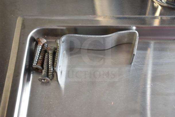 2019 Hoshizaki DD24 S kegerator detail; stainless steel surface with mounting bracket and screws.