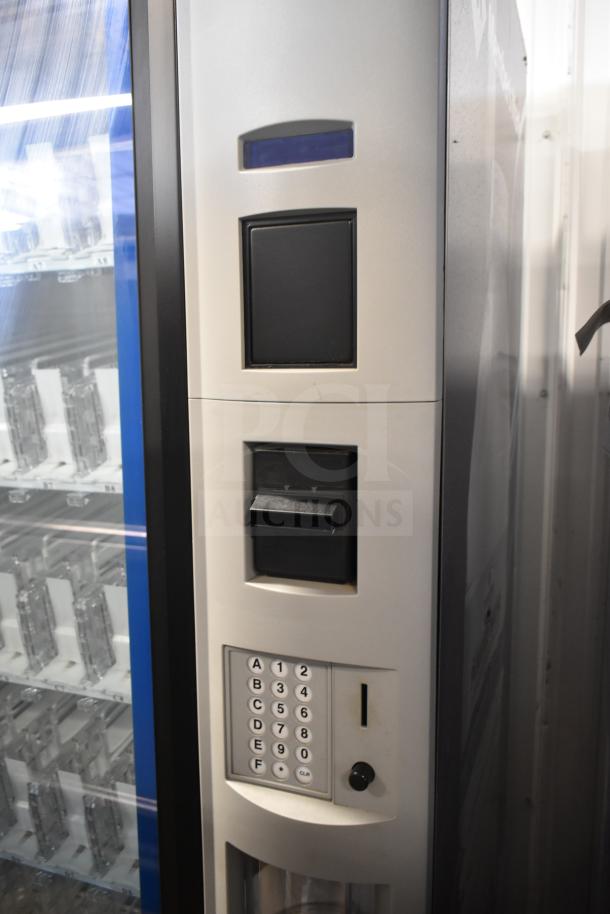 Crane 5800-4 commercial vending machine with bill acceptor. Displays keypad and coin slot. 115V, 1 Phase, good condition.