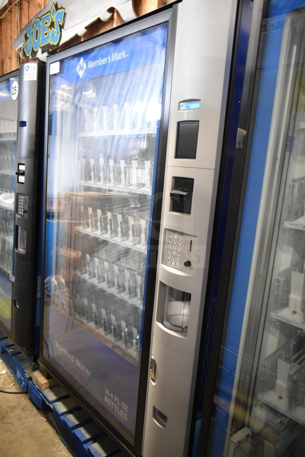 Crane 5800-4 commercial vending machine, silver, with bill acceptor and keypad, 115 volts, 1 phase, excellent condition.