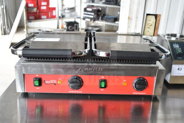 Brand new Avantco 177PG400 dual panini grill, grooved plates, 19 5/8" x 9 1/8" surface, 120V, scratch and dent condition.