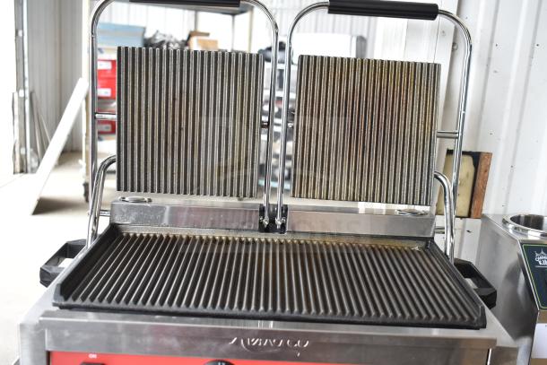 Avantco 177PG400 dual panini grill, grooved plates, 19 5/8" x 9 1/8" surface, brand new scratch and dent condition.