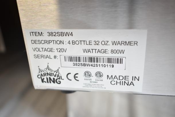 Brand new Carnival King 382SBW4, Quad 32 oz. Sauce Bottle Warmer, 120V, 1 Phase, scratch and dent condition, label visible.