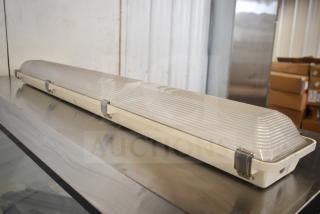 4' LED light fixture, model W/MEG34LED6LDASUNVDIM4080SLTYPE50, brand new scratch and dent, 60 available.