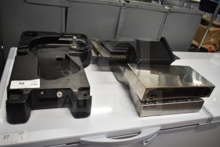 8 mixed items including cooler kick plate and ice machine head screen piece; features visible labels for auctions.