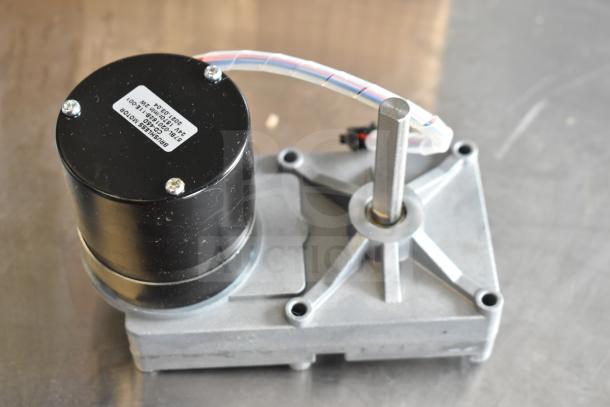 CD-45D Brushless Motor with label indicating model and specs on metal base, in good condition.