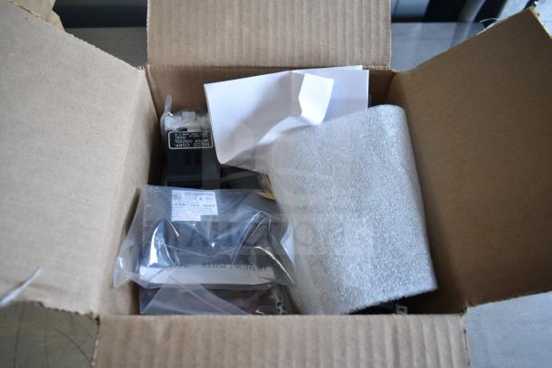 Cardboard box containing CD-45D Brushless Motor and Ametek WindJammer, both in protective packaging.