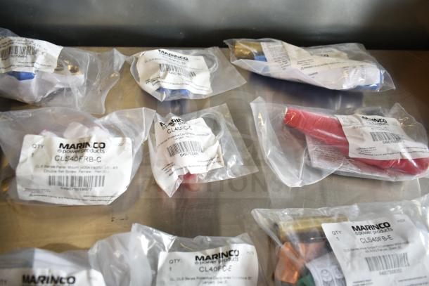 Assorted Marinco electrical items in sealed bags, models CLS40FRB-D, CL40FC-D, CLS40FB-D, and more, new condition.