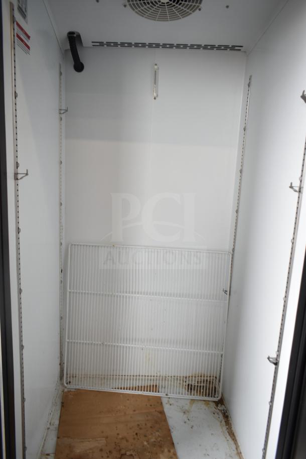 Beverage Air SF1HC-1S commercial single door freezer interior, visible ventilation and shelving, on commercial casters.