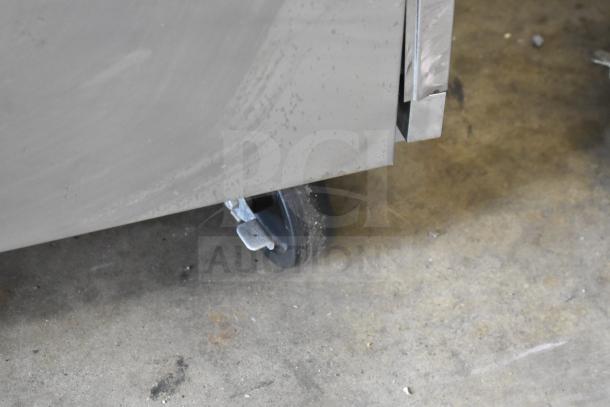 Beverage Air HR2-1S commercial 2-door reach-in cooler, showing lower corner and caster wheel, stainless steel, used condition.