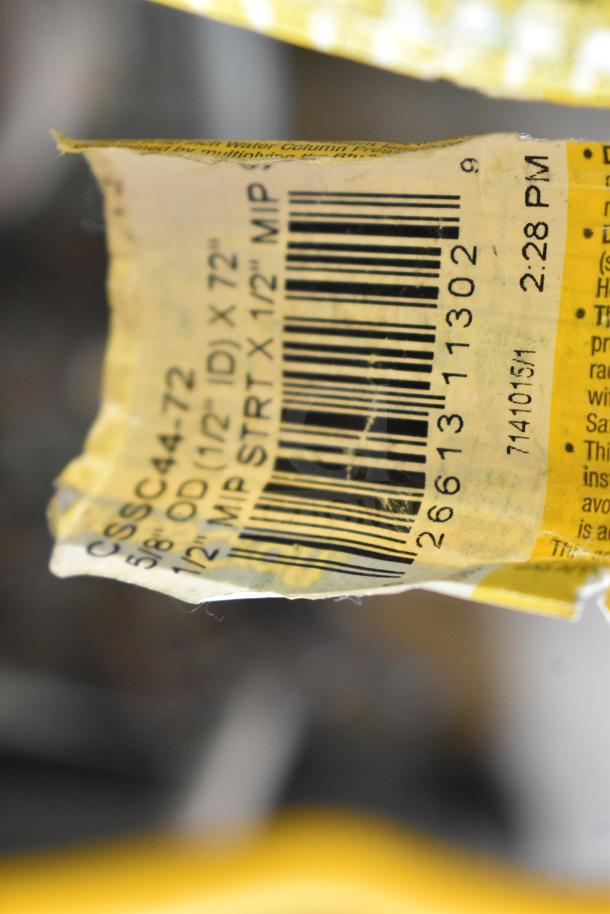 Close-up of a yellow label on a gas hose, showing text "5/8 OD (1/2 ID) x 72" and barcode details.