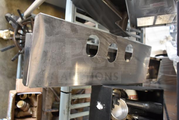 Alt text: 

Assorted metal portafilters and Turbo Air CONLOOP2848 condensate loop. Various poly pieces visible in used condition.