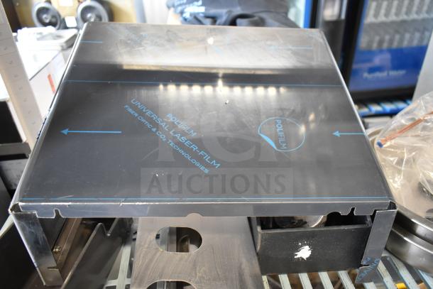 16 various items including portafilters, Turbo Air CONLOOP2848 condensate loop; Polifilm cover seen, good condition.