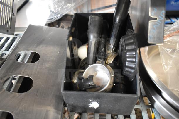 Box of 16 various items including portafilters and parts for ice cream machines. Features Turbo Air CONLOOP2848 condensate loop.