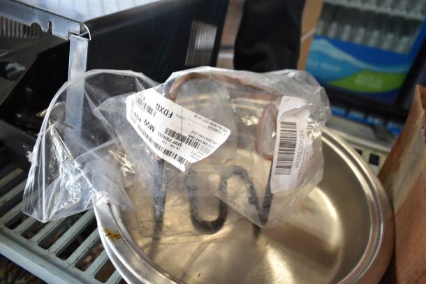 16 assorted items, including portafilters & Turbo Air CONLOOP2848 condensate loop, in good condition. Visible tags display model info.