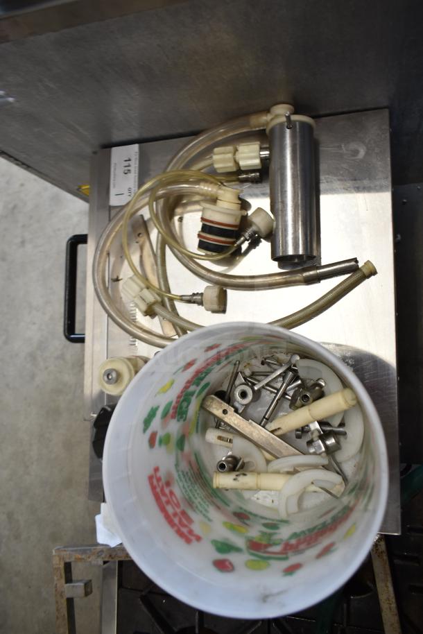 92 various ice cream machine parts, including handles, hoses, and metal components, in mixed condition. Auction set.
