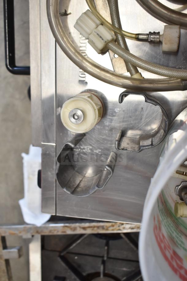 92 ice cream machine parts, including handles and hoses, on metal surface. Various connectors visible. Auction: 92 times bid.