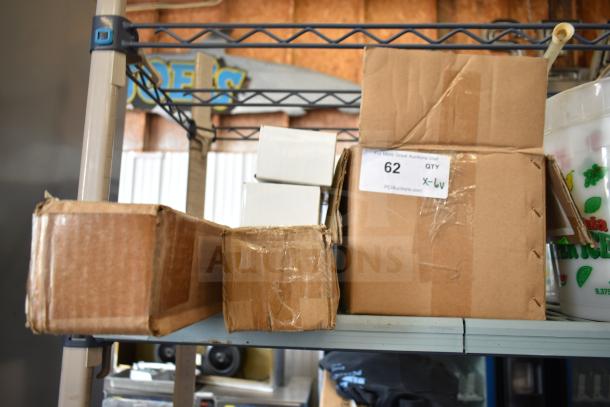 6 various items including Nut Master K2811 and KoolMore legs in boxes. Label shows "QTY 6" and auction number 62.