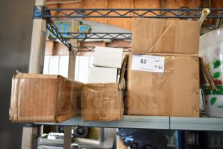 6 various items including Nut Master K2811 and KoolMore legs in boxes. Label shows "QTY 6" and auction number 62.