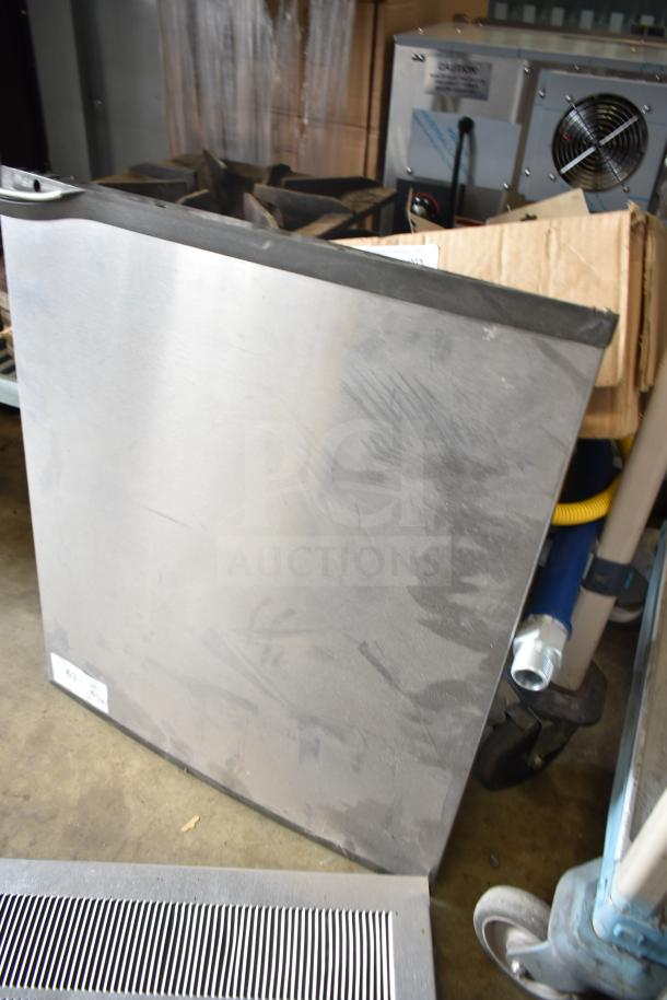 Three assorted items including Cornelius ice head panels, metallic surface, visible wear, industrial setting.