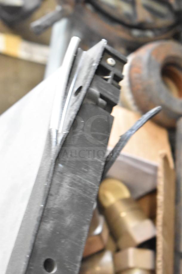 Close-up of Cornelius Ice Head Panels, slightly worn, with visible hardware components in the background.