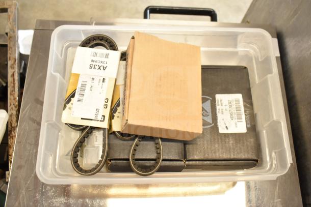 Clear bin with 8 items, including AX35 belt, Taylor Probe X31602, MU1238A-51B MU Series axial fan, and spare parts kits.