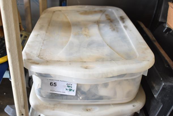 A plastic storage bin containing 54 various items, including Taylor ice cream machine parts, labeled for auction as Lot 65.