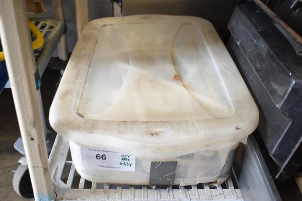 Plastic bin containing Taylor ice cream machine parts, labeled "66 QTY MIX x-63V." Bin shows wear.