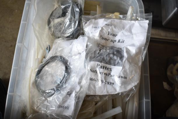 Box containing 63 Taylor ice cream machine parts, including Partex tune-up kits in plastic bags.