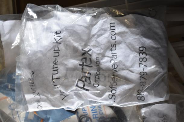 Bag labeled "Partex Tune-up Kit" containing various Taylor ice cream machine parts, including seals and rings.
