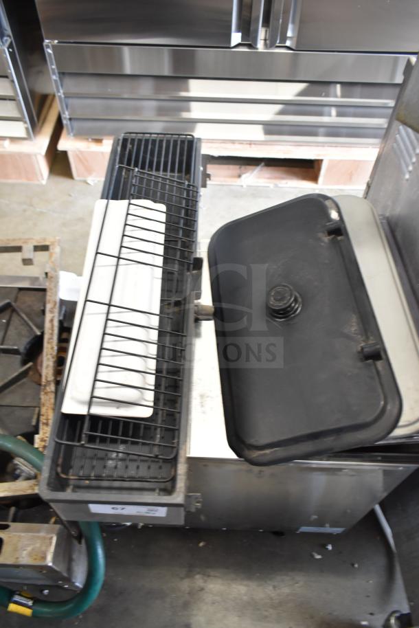 40 item lot including ice cream and frozen beverage machine parts, shown with metal and plastic components in industrial setting.