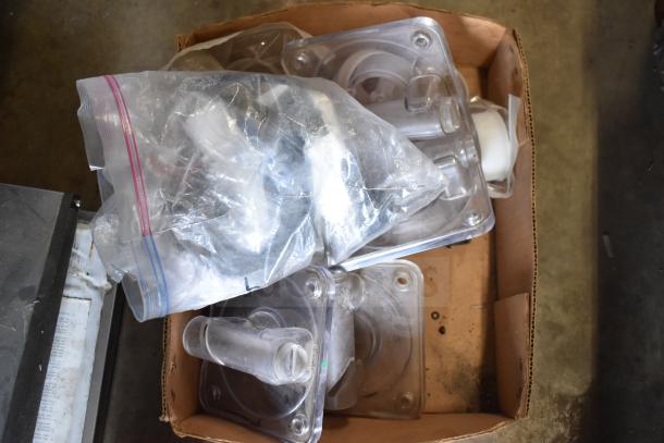 Box of 40 ice cream and frozen beverage machine parts, including clear plastic components, some in plastic bags.