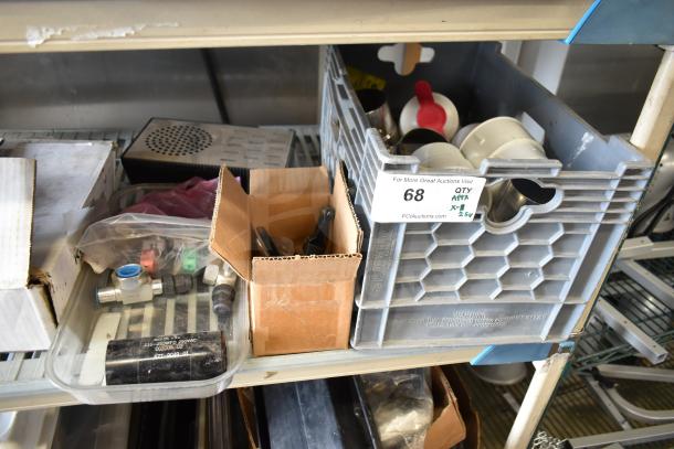 31 various kitchen items including drip tray, spigots, mixing cup collars, displayed in boxes on a metal shelf.
