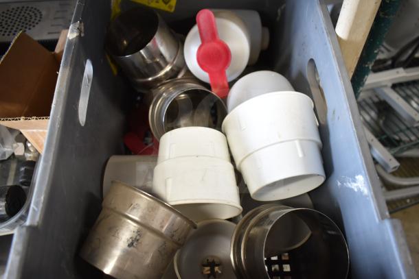 Assorted items including drip tray, spigots, and mixing cup collars. Various conditions, plastic and metal materials.