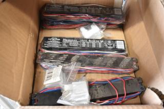 Box of 8 Keystone ballasts, model KTEB-259-UV-IS-N, with red and blue wiring, condition appears gently used.