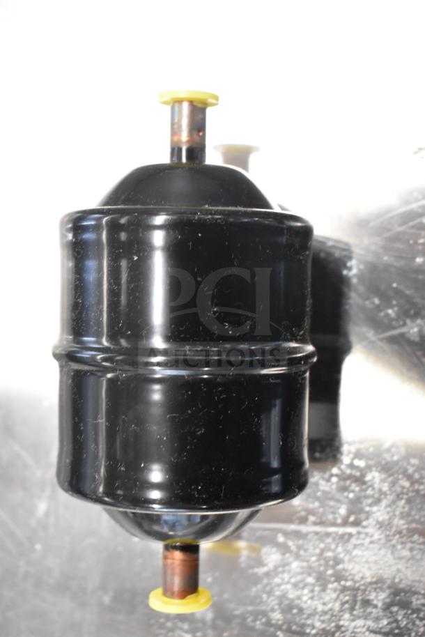 2 Danfoss Eliminator Filter Driers; black, cylindrical design, visible yellow caps. Ideal for HVAC systems.