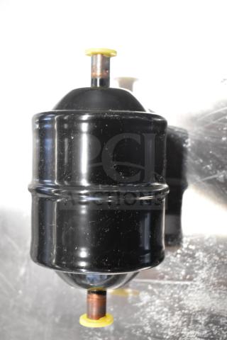 2 Danfoss Eliminator Filter Driers; black, cylindrical design, visible yellow caps. Ideal for HVAC systems.