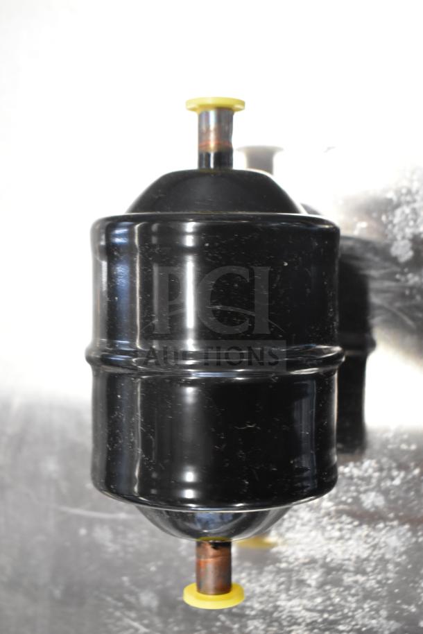 Danfoss Eliminator Filter Drier, black, new condition, yellow caps, for refrigeration systems. Auction includes two units.