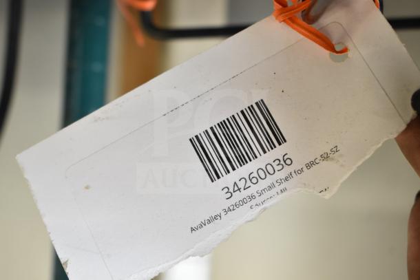 AvaValley 34260036 small shelf label for BRC-52-SZ; barcode visible, tied with orange string.