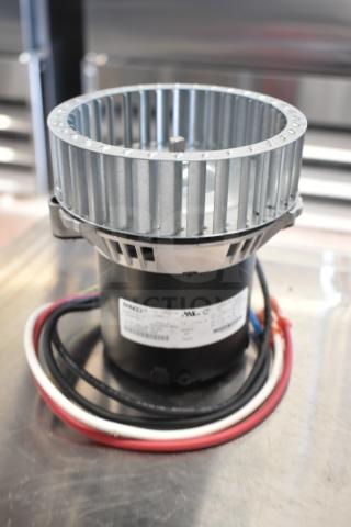 Brand new Fasco 3.3" diameter shade motor, 115/208-230V, 1 phase, for warming cabinet. Minor scratch and dent visible.