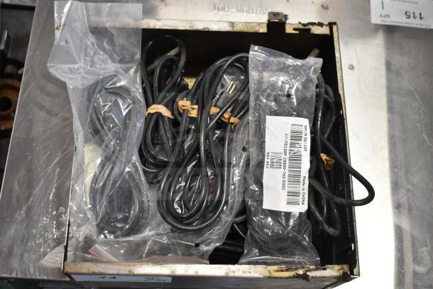 Box of 19 various items, including wires and a drip tray, with labels indicating model numbers and origins.