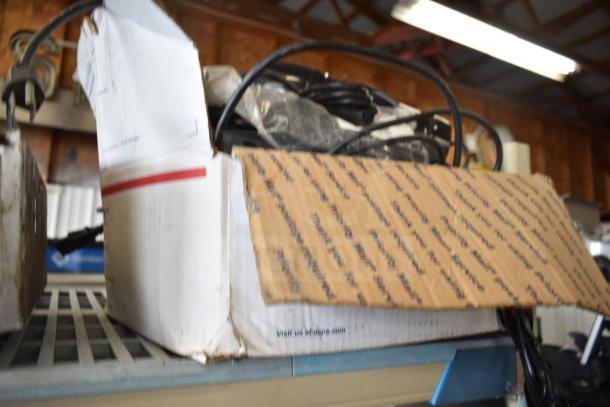 Box of 42 assorted items including an air pot and wires, shown in used condition, with shipping labels visible.