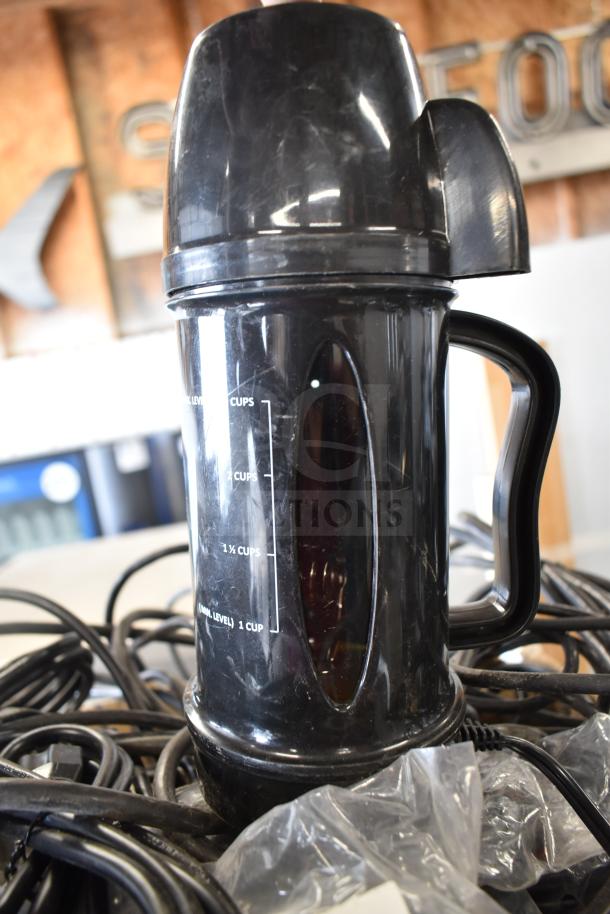 Black air pot with measurement markings, surrounded by various wires, visible wear. 42 assorted items included.