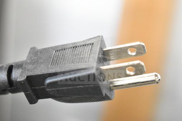 Close-up of a power plug for the 2025 Nemco 6100A 7 Qt. Countertop Warmer, 120 Volts, 1 Phase.