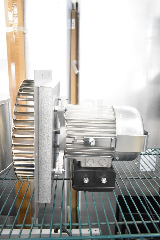 BRAND NEW Nidec Motor 2025, 115-120V, 1 phase, slight scratches. Silver finish, mounted on metal frame.